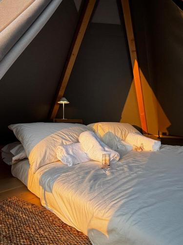 a bed in a tent with two pillows at La Torre in Pavullo nel Frignano