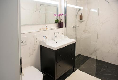 a bathroom with a sink and a shower at Rosaliya in Cochem