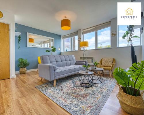 a living room with a couch and a rug at Contractors and Relocations Haven with Parking in Basingstoke
