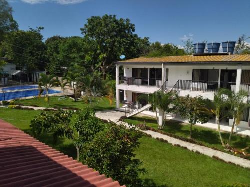 a house with a yard and a swimming pool at Llano grande rivera in Rivera