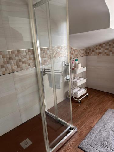 a shower with a glass door in a bathroom at !Chalet de lujo para vacaciones!... in Camargo