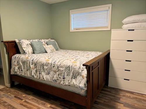 a small bedroom with a bed and a dresser at RR-Birch_Creek 2 in June Lake
