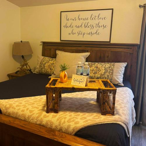 a bed with a tray with a table on it at The Lodge in O'Brien