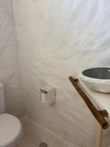a bathroom with a toilet and a sink at REFUGIO do SAGRADO MORERE Tropical Lodge - A CASA das BRUXAS in Moreré
