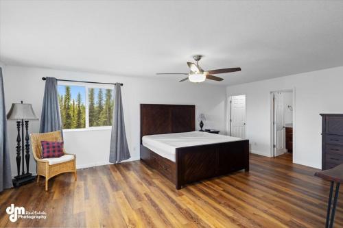 a bedroom with a bed and a ceiling fan at Soldotna-Kenai Peninsula House in Soldotna