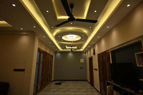 a ceiling in a hallway with a ceiling fan at Sai Guest House in Chavakachcheri