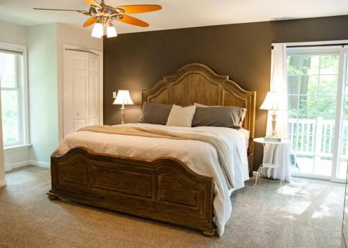 a bedroom with a large bed and a ceiling fan at Family-Friendly Strasburg Escape | 50 Mile Views in Strasburg