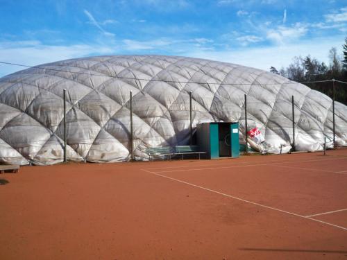 a large domed building on a tennis court at Holiday Apartments in Karlovy Vary