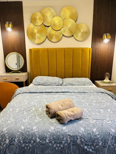 a bedroom with a bed with a towel on it at Haven Stays - D15A5DF in Tyrrelstown