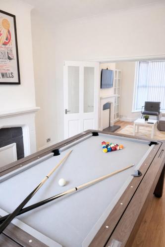 a living room with a snooker table at 4 bedrooms 8 beds Wi-FI smart tv games room in Hull