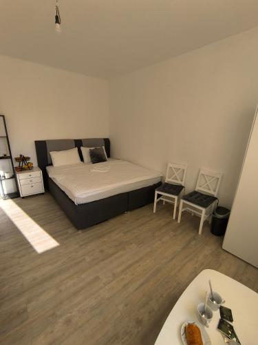 a bedroom with a bed and a sink in it at Central Hostel Nurnberg in Nuremberg