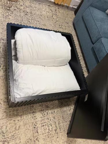 two white pillows in a black box on the floor at Private King Suite Near DC & Joint Base Andrews in District Heights