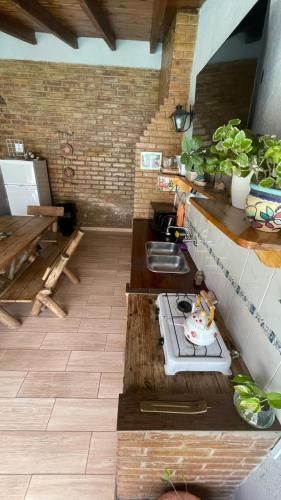 a small kitchen with a stove and a sink at Cassara Retreat in La Consulta
