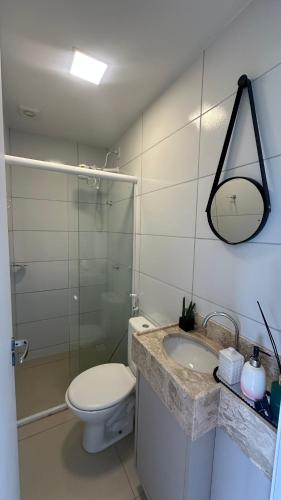 a bathroom with a toilet and a sink and a shower at Studio V Ininga in Teresina
