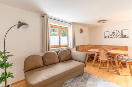 a living room with a couch and a table at Stolz 1 in Blaichach