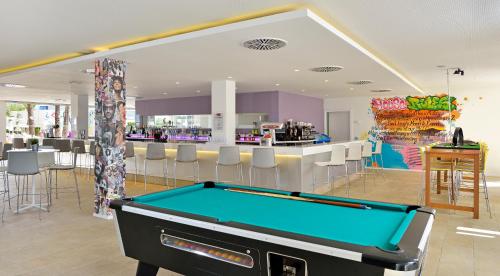 a pool table in a room with a bar at Sol House The Studio - Calviá Beach - Adults Only in Magaluf
