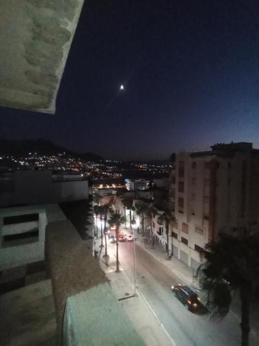 a view of a street at night with cars at Tetuan in Tétouan
