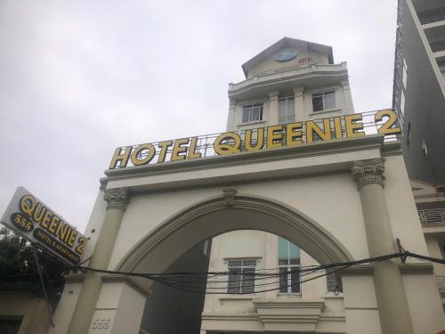 a hotel entrance with a sign on top of a building at Queenie Hotel 2 in Hai Phong