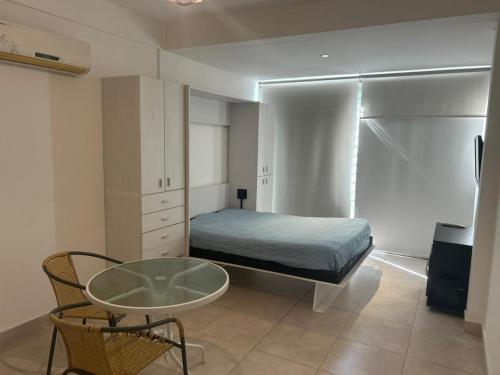 a bedroom with a bed and a table in it at Las Piedras in Pilar