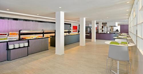 a restaurant with a buffet line with food at Sol House The Studio - Calviá Beach - Adults Only in Magaluf