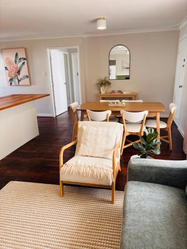 a living room with a table and chairs at Esperance Seaside Cottage in Esperance