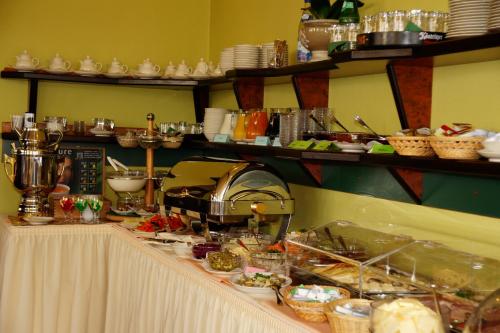 a buffet line with food on a table at Hotel Stranddistel Rügen in Göhren