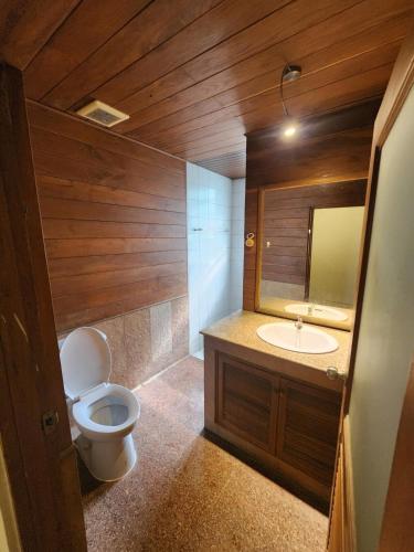 a bathroom with a toilet and a sink at Little Bro Mae Hong Son in Ban Mai