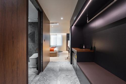 a bathroom with a sink and a toilet in a room at 구미 더혜밀호텔 in Gumi
