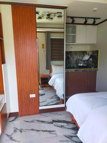 Postelja oz. postelje v sobi nastanitve Kabayan's Hotel