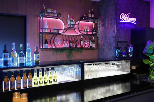 a bar with a bunch of bottles of wine at Kuromon Crystal Hotel in Osaka