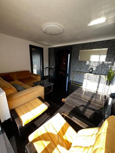 a living room with a couch and a table at Mountain View Home in Zalău