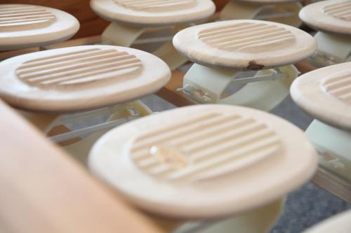 a row of white stools sitting next to each other at AKZENT Hotel Altes Casino in Fulda