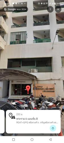 a group of motorcycles parked in front of a building at Mansion phram6 B in Bangkok