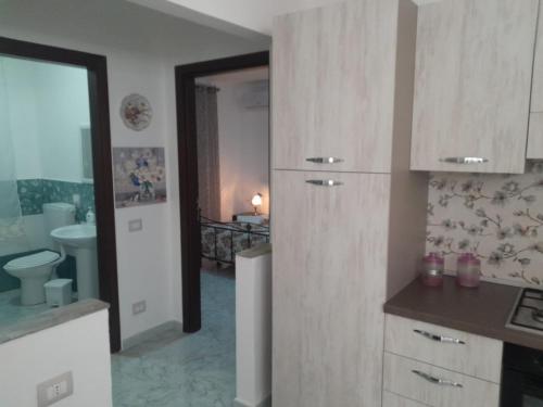 a kitchen with a sink and a counter top at Il Sole Di Lampedusa in Lampedusa