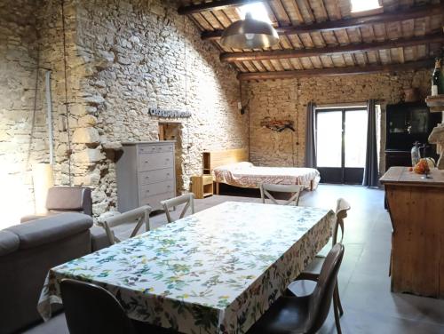 a living room with a table and a bedroom at Casale Bavi in Ortona