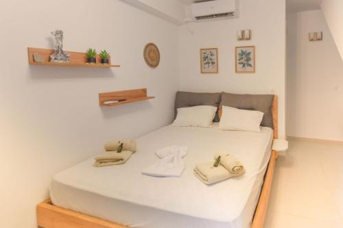 Ένα ή περισσότερα κρεβάτια σε δωμάτιο στο Sokaki