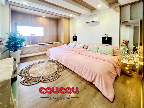 a bedroom with a large bed in a room at CouCou Homestead II - Mini Hotel District 1 in Ho Chi Minh City