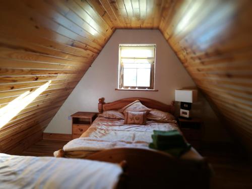 Postel nebo postele na pokoji v ubytování Assaroe House