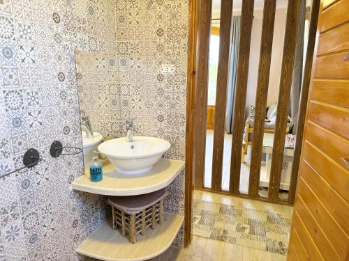 a bathroom with a sink and a mirror at Citadel Luxor in Luxor