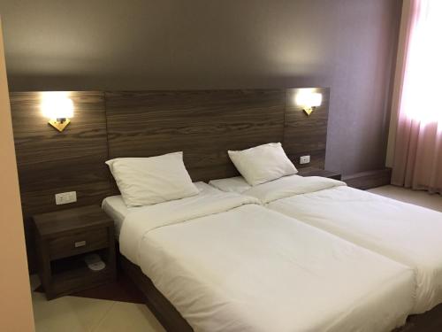 Postel nebo postele na pokoji v ubytování Primer Hotel