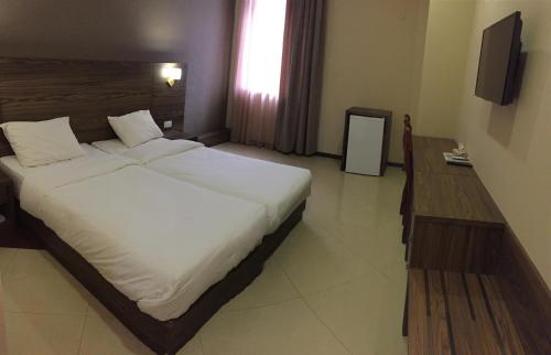 Postel nebo postele na pokoji v ubytování Primer Hotel