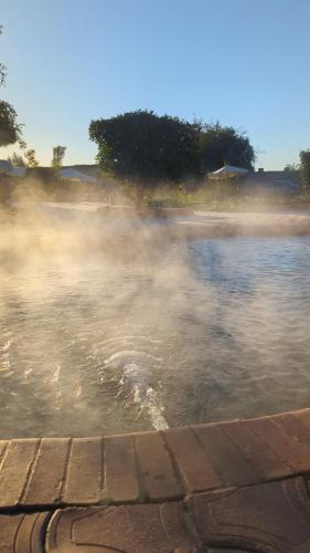 a body of water with a body of water with a beach at Cafour House Siwa - Hot Spring in Siwa