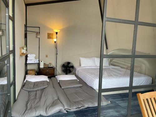 two bunk beds in a room with at Homestay in Nhơn Trạch