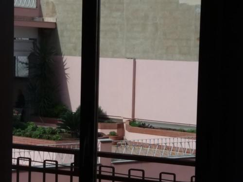 a view of a patio from a window at Albergo Europa in Vittoria