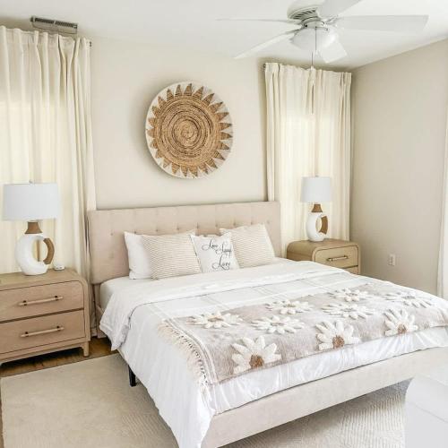 a bedroom with a large bed and two night stands at Spacious Private 2BR-2BA I Pool I Garage I Central in Rehoboth Beach