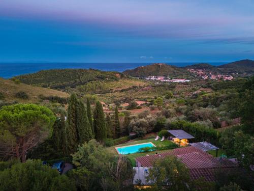 an aerial view of a house with a swimming pool at Porto Ercole Prestige Villa in Cala Galera
