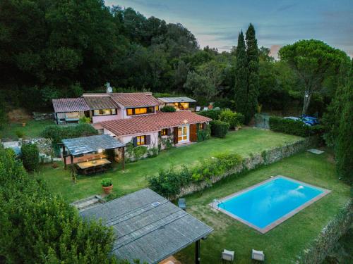 an aerial view of a house with a swimming pool at Porto Ercole Prestige Villa in Cala Galera