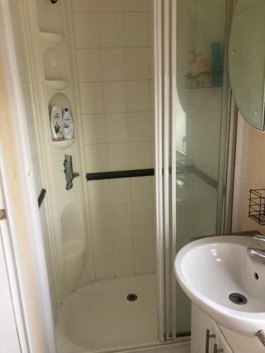 a bathroom with a shower and a sink at Prime fishing location in Retford