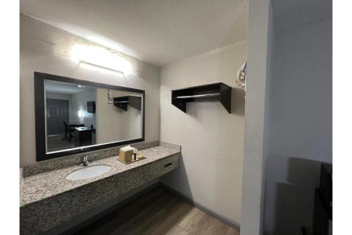 a bathroom with a sink and a mirror at Gazelle Stay by Hotel O Socorro in Socorro