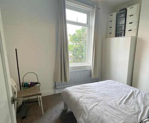 a bedroom with a white bed and a window at HNFC Stays - Shoreline Flat in South Shields